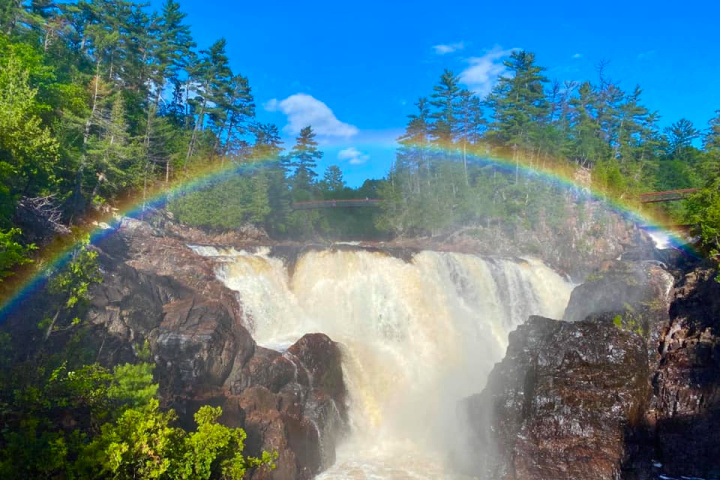 a large waterfall in a forest