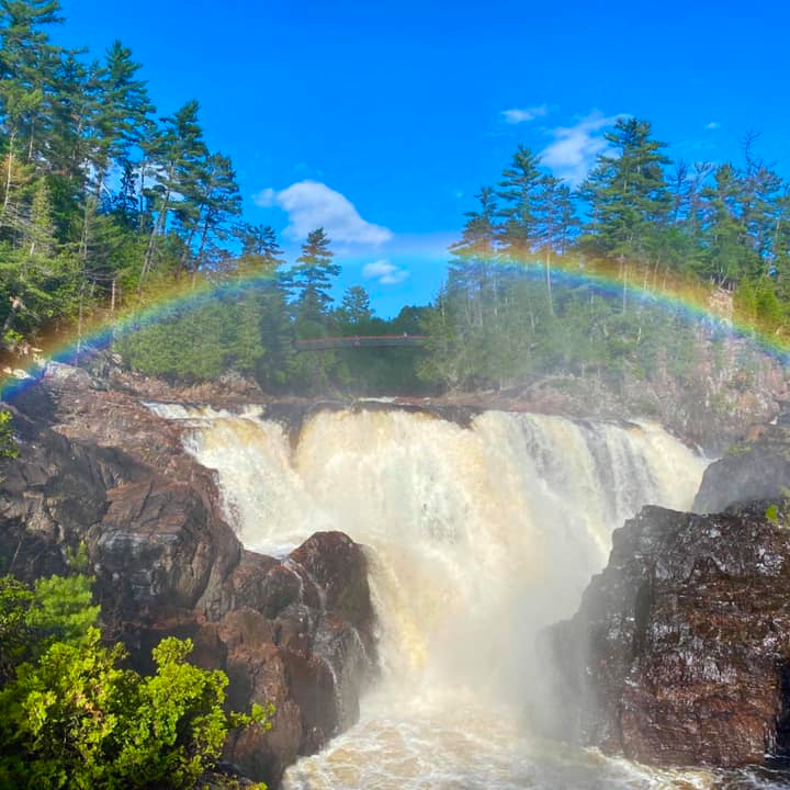 a large waterfall in a forest
