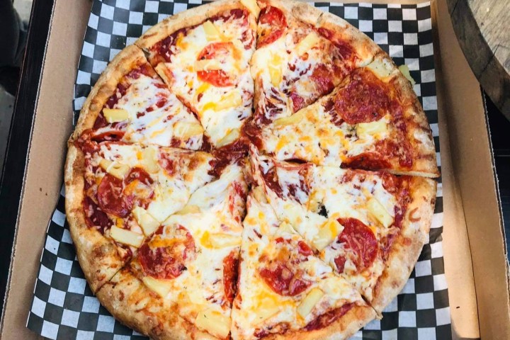 a pizza sitting on top of a table