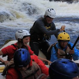 a group of people on a raft