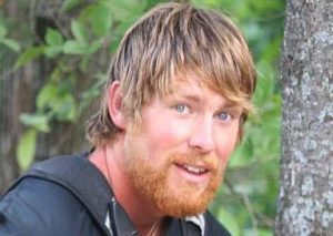 “Jedi” Ty Smith a man standing in front of a forest