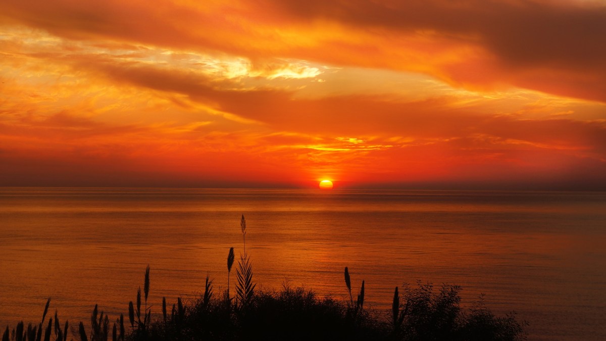 a sunset over a beach