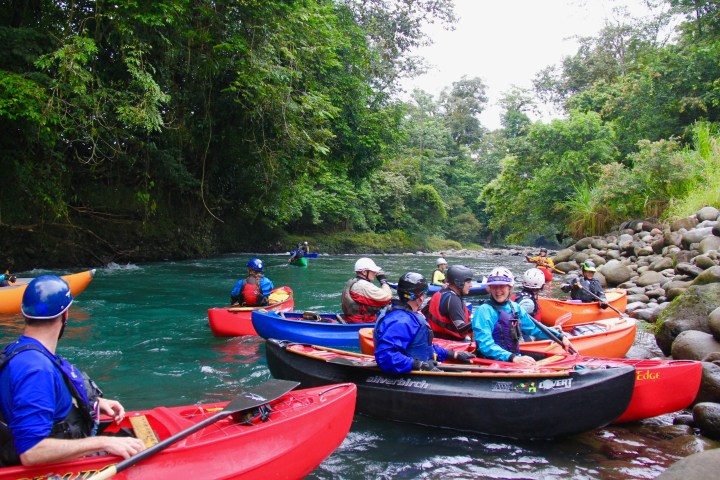 a group of people riding on the back of a boat