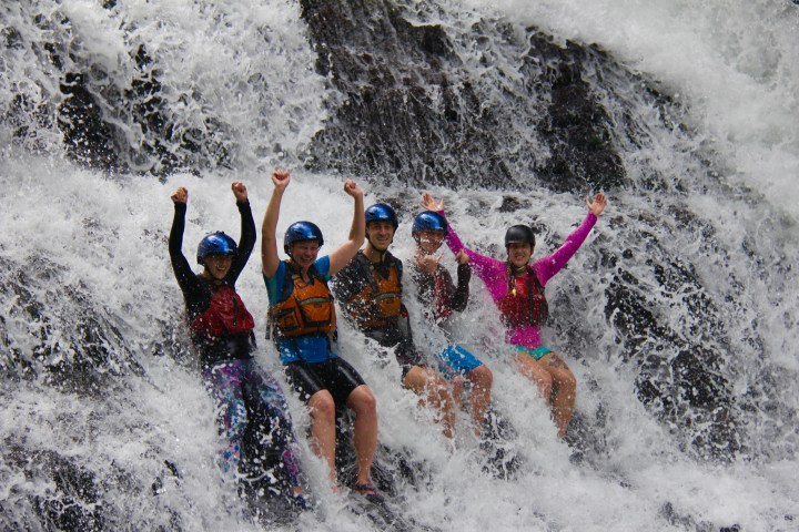 a man riding a wave on top of a body of water