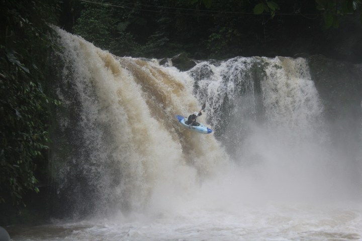 a man riding on the back of a waterfall