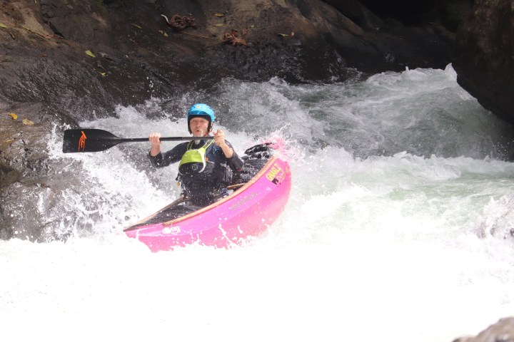 a person riding a wave on a surfboard in the water
