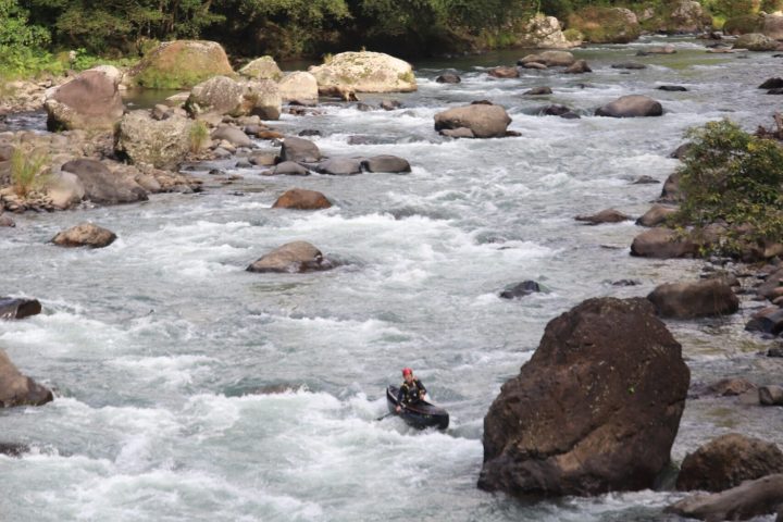 a group of people riding skis on a body of water